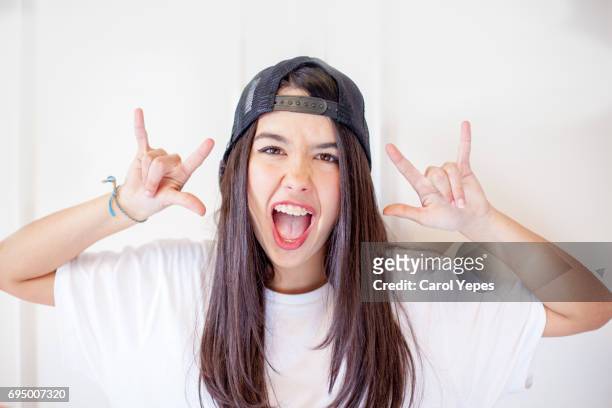 cool brunette girl teenager portrait - heavy metal stock-fotos und bilder