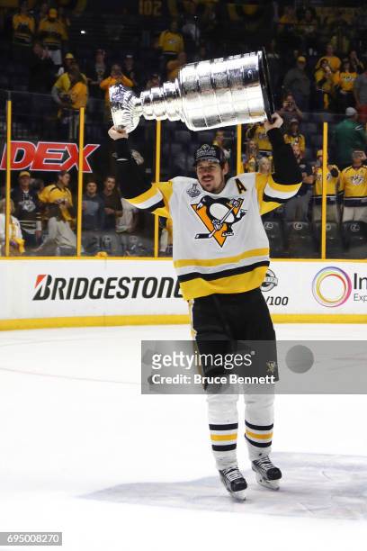 Evgeni Malkin of the Pittsburgh Penguins celebrates with the Stanley Cup Trophy after they defeated the Nashville Predators 2-0 in Game Six of the...