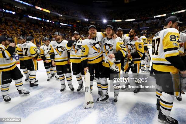 Patric Hornqvist of the Pittsburgh Penguins celebrates with Carl Hagelin after they defeated the Nashville Predators 2-0 in Game Six of the 2017 NHL...