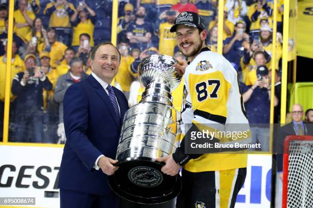 Commissioner Gary Bettman poses for a photo with Sidney Crosby of the Pittsburgh Penguins after they defeated the Nashville Predators 2-0 to win the...