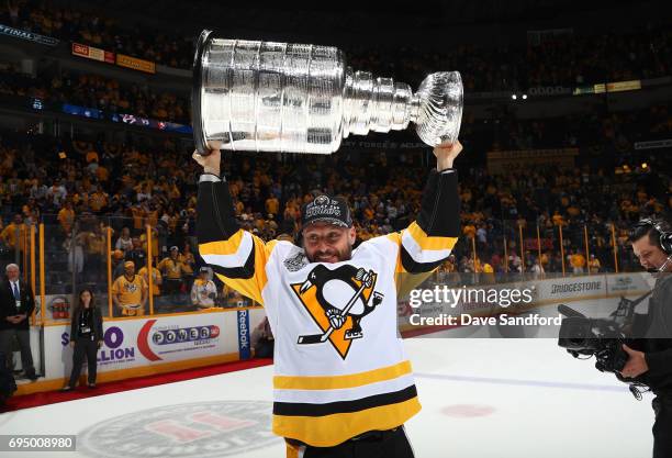 Mark Streit of the Pittsburgh Penguins lifts the Stanley Cup after Game Six of the 2017 NHL Stanley Cup Final at the Bridgestone Arena on June 11,...