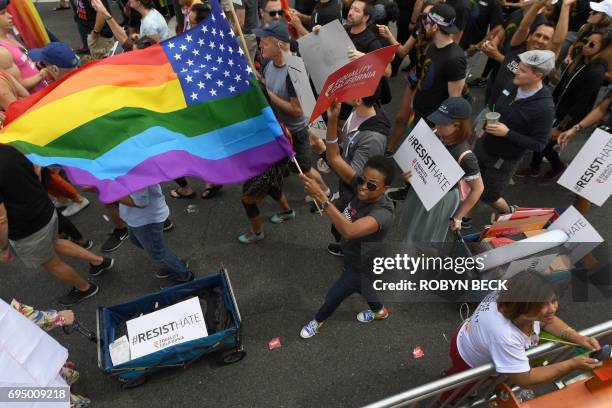 Members of the LGBT community and their supporters participate in the #ResistMarch at the 47th annual LA Pride Festival in Hollywood, California on...