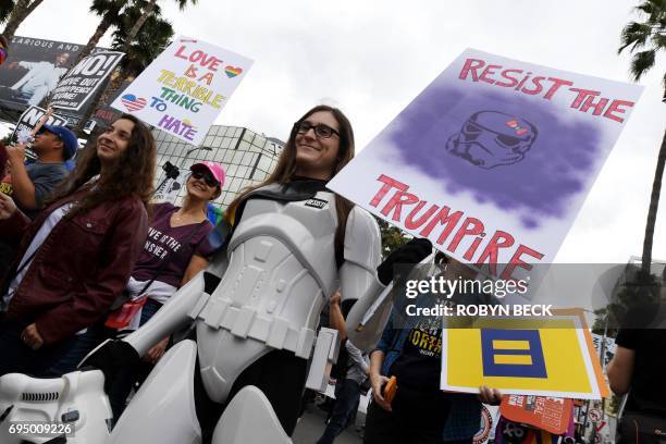 Members of the LGBT community and their supporters participate in the #ResistMarch at the 47th annual LA Pride Festival in Hollywood, California on...