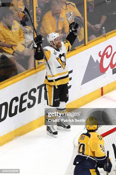 Patric Hornqvist of the Pittsburgh Penguins celebrates with teammates after scoring a goal against Pekka Rinne of the Nashville Predators during the...