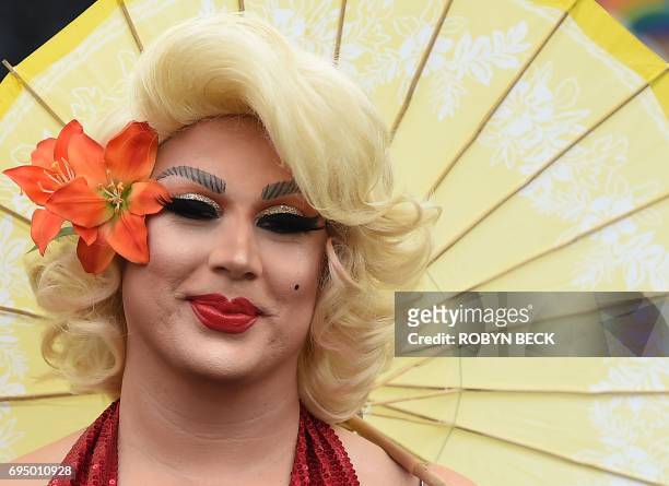Members of the LGBT community and their supporters participate in the #ResistMarch at the 47th annual LA Pride Festival in Hollywood, California on...