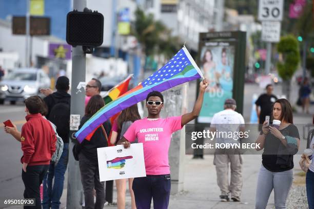 Members of the LGBT community and their supporters participate in the #ResistMarch at the 47th annual LA Pride Festival in Hollywood, California on...