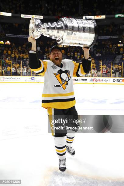 Patric Hornqvist of the Pittsburgh Penguins celebrates with the Stanley Cup Trophy after they defeated the Nashville Predators 2-0 to win the 2017...