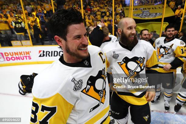 Sidney Crosby of the Pittsburgh Penguins celebrates with Nick Bonino after they defeated the Nashville Predators 2-0 in Game Six of the 2017 NHL...