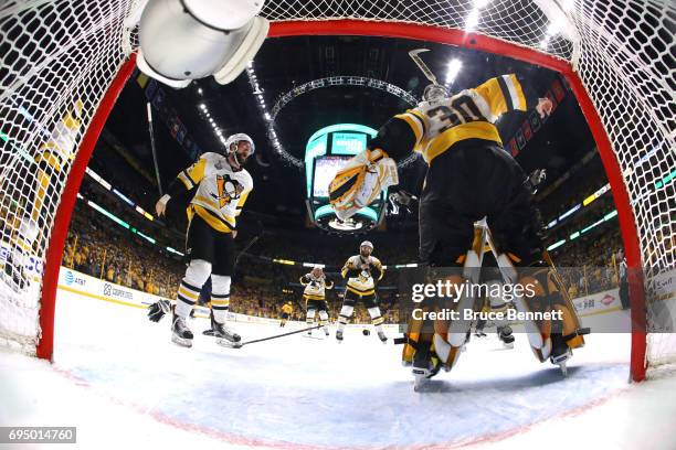 Matt Murray of the Pittsburgh Penguins celebrates with Brian Dumoulin after they defeated the Nashville Predators 2-0 in Game Six of the 2017 NHL...