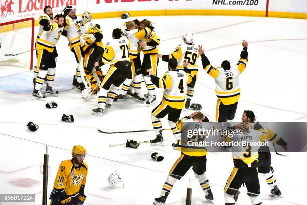 Matt Murray of the Pittsburgh Penguins celebrates with teammates after they defeated the Nashville Predators 2-0 to win the 2017 NHL Stanley Cup...