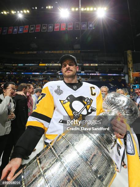 Captain Sidney Crosby of the Pittsburgh Penguins holds the Stanley Cup after Game Six of the 2017 NHL Stanley Cup Final at the Bridgestone Arena on...
