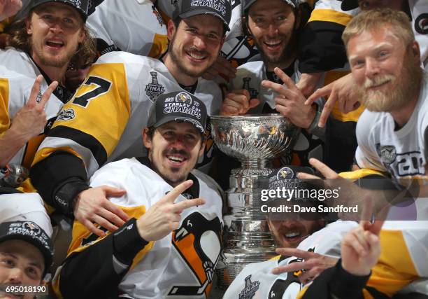 Captain Sidney Crosby, Evgeni Malkin, Matt Cullen, Carl Hagelin, Brian Dumoulin and their Pittsburgh Penguins teammates pose for a team photo with...