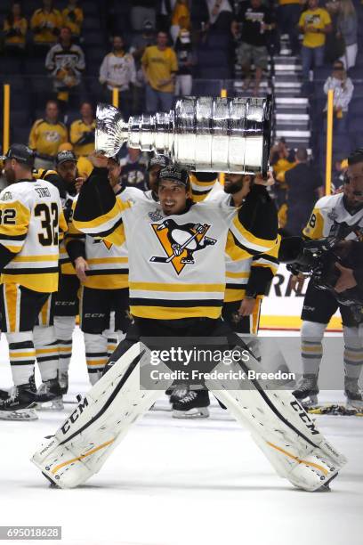 Marc-Andre Fleury of the Pittsburgh Penguins celebrates with the Stanley Cup Trophy after defeating the Nashville Predators 2-0 in Game Six of the...