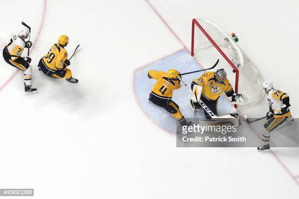 Patric Hornqvist of the Pittsburgh Penguins scores the game-winning goal past goalie Pekka Rinne of the Nashville Predators in the third period in...