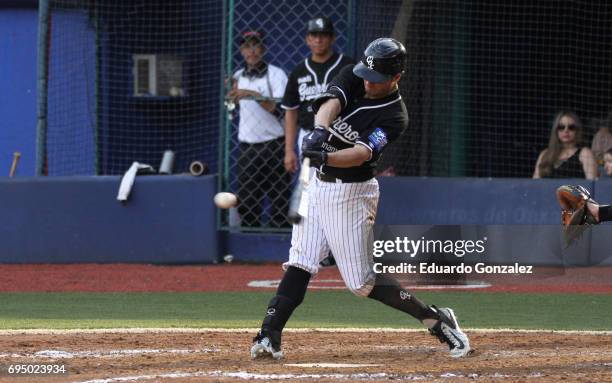 Alex Gonzalez of Guerreros de Oaxaca swings the ball during the match between Piratas de Campeche and Guerreros de Oaxaca as part of the Liga...