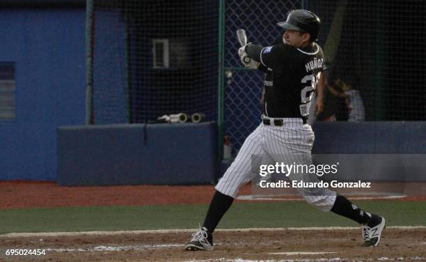 Adan Muñoz of Guerreros de Oaxaca swings the ball during the match between Piratas de Campeche and Guerreros de Oaxaca as part of the Liga Mexicana...