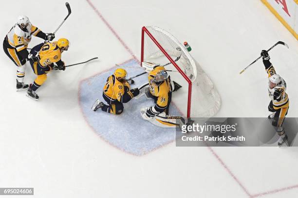 Patric Hornqvist of the Pittsburgh Penguins celebrates after scoring the game-winning goal past goalie Pekka Rinne of the Nashville Predators in the...