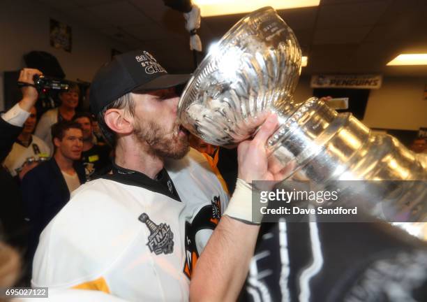 Matt Murray of the Pittsburgh Penguins drinks out of the Stanley Cup in the locker room after Game Six of the 2017 NHL Stanley Cup Final at the...