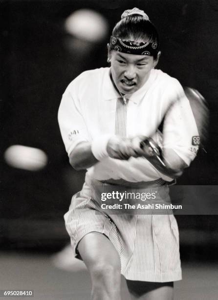 Kimiko Date of Japan plays a backhand during day one of the FED Cup World Group Quarterfinal between Japan and Germany at Ariake Coliseum on April...