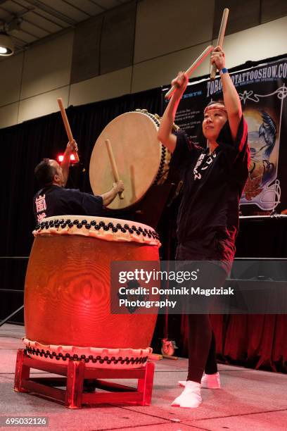 Japanese group Arashido Taiko drums during day three of the "19th Annual Northern Ink Xposure Tattoo Convention" at the Metro Toronto Convention...