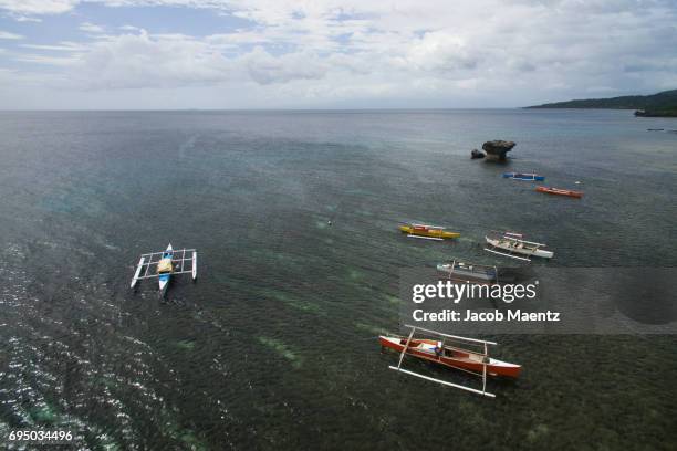 fishing boats from above on siquijor island. - siquijor islands stock pictures, royalty-free photos & images