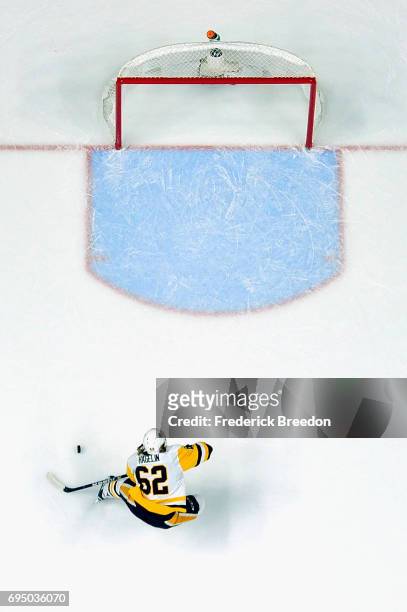 Carl Hagelin of the Pittsburgh Penguins scores a empty net goal during the third period against the Nashville Predators in Game Six of the 2017 NHL...