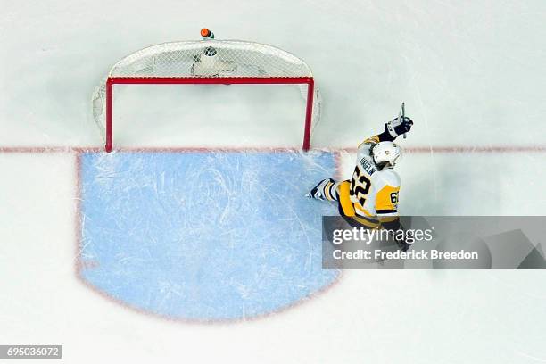 Carl Hagelin of the Pittsburgh Penguins scores a empty net goal during the third period against the Nashville Predators in Game Six of the 2017 NHL...