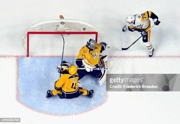 Patric Hornqvist of the Pittsburgh Penguins scores a goal against Pekka Rinne of the Nashville Predators during the third period in Game Six of the...