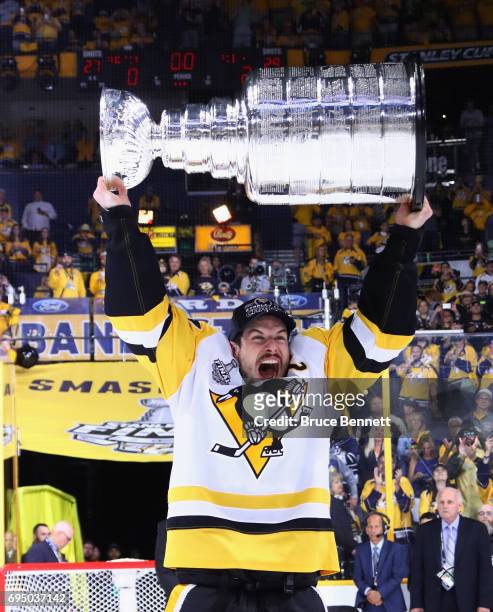Sidney Crosby of the Pittsburgh Penguins celebrates with the Stanley Cup Trophy after they defeated the Nashville Predators 2-0 to win the 2017 NHL...