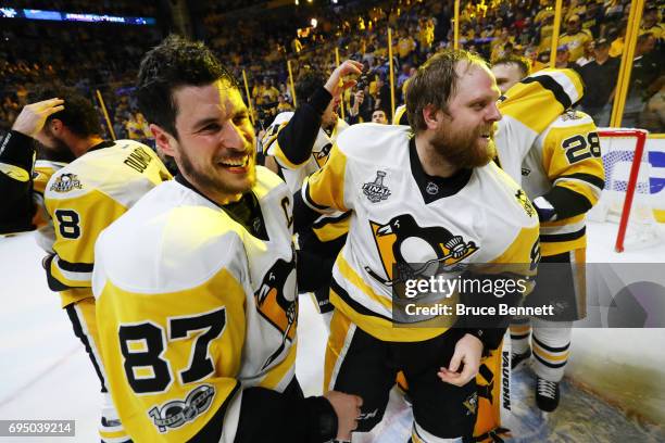 Sidney Crosby and Phil Kessel of the Pittsburgh Penguins celebrate their 2-0 win over the Nashville Predators to win the 2017 Stanley Cup in Game Six...