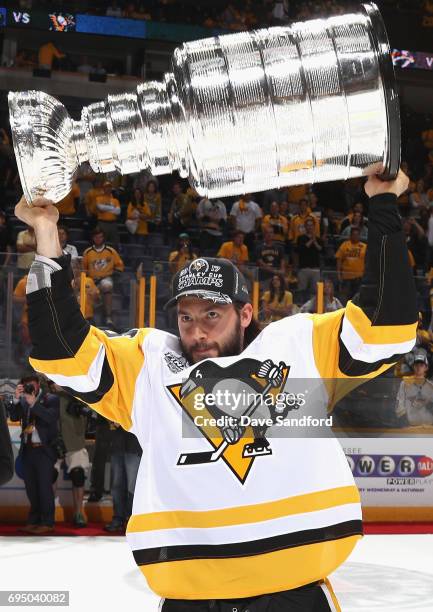 Kris Letang of the Pittsburgh Penguins lifts the Stanley Cup after the Penguins defeated the Nashville Predators 2-0 to win the 2017 NHL Stanley Cup...