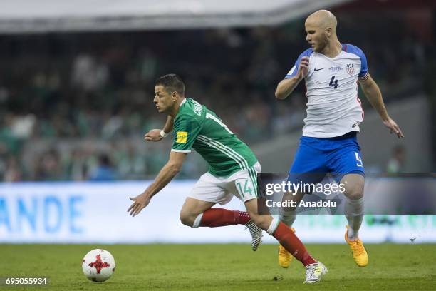 Javier Hernandez of Mexico fights for the ball with Michael Bradley of United States during the match between Mexico and United States as part of the...