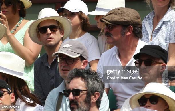 Guillaume Canet and Jean Dujardin attend the men's final on day 15 of the 2017 French Open, second Grand Slam of the season at Roland Garros stadium...