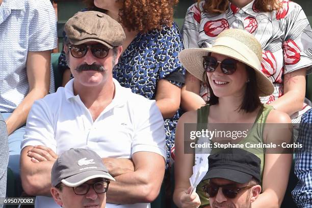 Jean Dujardin and Nathalie Pechalat attend the Men Final of the 2017 French Tennis Open - Day Fithteen at Roland Garros on June 11, 2017 in Paris,...