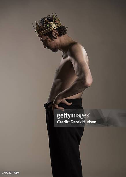 German film and theatre actor Lars Eidinger pictured wearing a prop crown that he uses for his Richard III role and photographed here in a makeshift...