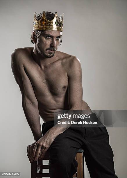 German film and theatre actor Lars Eidinger pictured wearing a prop crown that he uses for his Richard III role and photographed here in a makeshift...