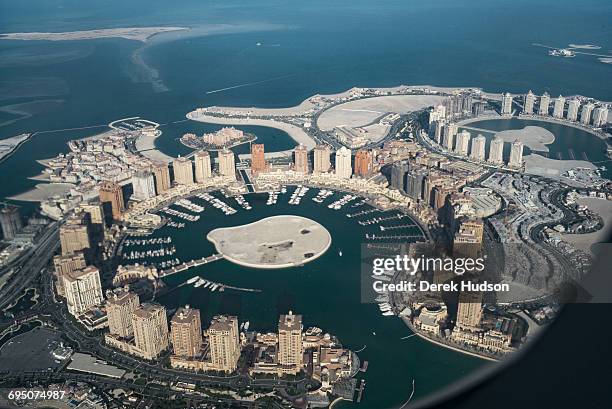 View of the artificial island known as The Pearl that spans nearly 4 million square meters jutting out from the city of Doha, 350 metres offshore of...