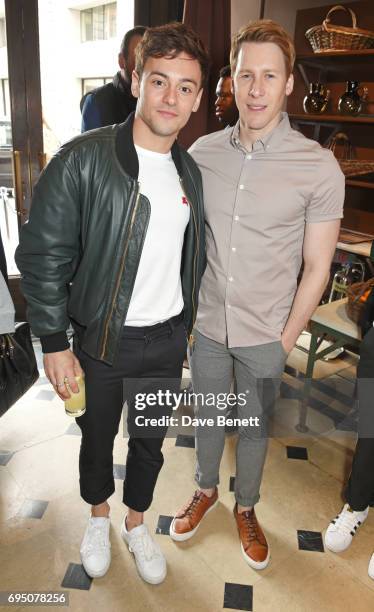 Tom Daley and Dustin Lance Black attend a breakfast hosted by Christopher Bailey, Dame Natalie Massenet and Dylan Jones in celebration of London...