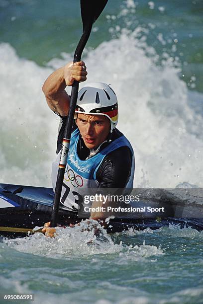 German slalom canoeist Thomas Schmidt competes for Germany to finish in first place to win the gold medal in the Men's slalom K-1 kayak canoe event...