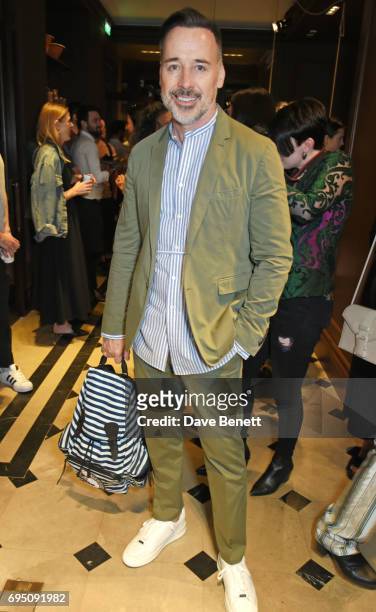 David Furnish attends a breakfast hosted by Christopher Bailey, Dame Natalie Massenet and Dylan Jones in celebration of London Fashion Week Men's at...