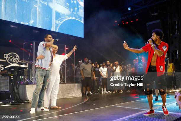 Trey Songz takes a photo of Dave East and his mother during the 2017 Hot 97 Summer Jam at MetLife Stadium on June 11, 2017 in East Rutherford, New...