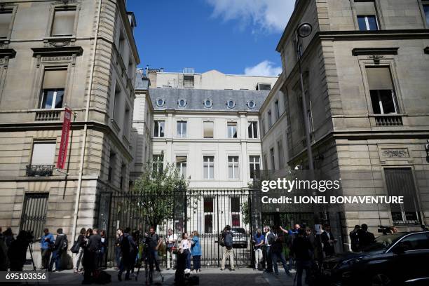 Journalists stand outside the French Socialist Party headquarters in Paris on June 12, 2017 a day after the first round of France's legislative...