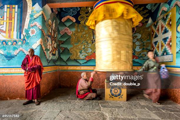 golden prayer wheel in bhutan - bhutan monks stock pictures, royalty-free photos & images
