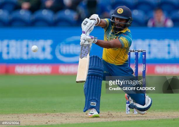 Sri Lanka's Niroshan Dickwella plays a shot during the ICC Champions Trophy match between Sri Lanka and Pakistan in Cardiff on June 12, 2017. / AFP...