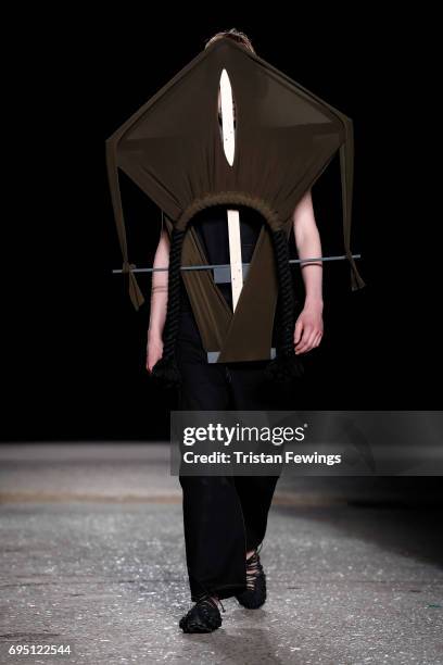 Model walks the runway at the Craig Green show during the London Fashion Week Men's June 2017 collections on June 12, 2017 in London, England.