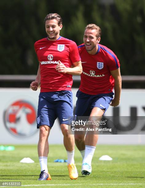 Adam Lallana and Harry Kane run through drills during the England training session at the Chemin De Ronde Stadium on June 12, 2017 in...