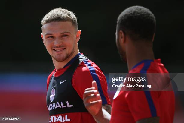 Kieran Trippier chats with teamate Raheem Sterling during the England training session at the Chemin De Ronde Stadium on June 12, 2017 in...