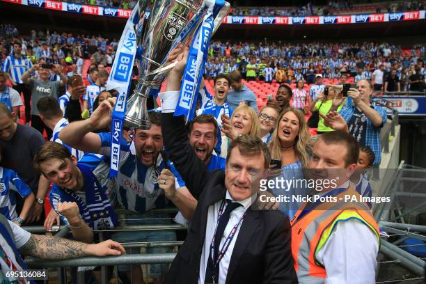 Huddersfield Town chairman Dean Hoyle with the trophy after winning the Sky Bet Championship play-off final at Wembley Stadium, London.