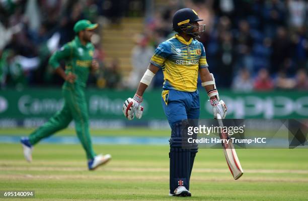 Kusal Mendis of Sri Lanka walks off after being dismissed during the ICC Champions Trophy match between Sri Lanka and Pakistan at SWALEC Stadium on...