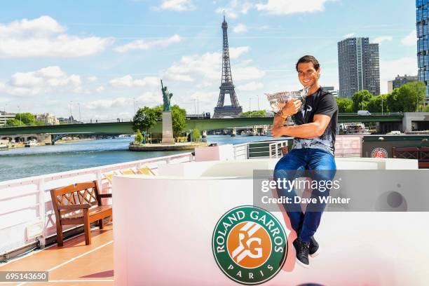 Rafael Nadal of Spain poses during a photocall to celebrate his record breaking 10th French Open title at Quai de Grenelle on June 12, 2017 in Paris,...